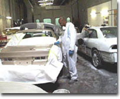 man painting a car