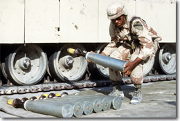 soldier holding a DU round